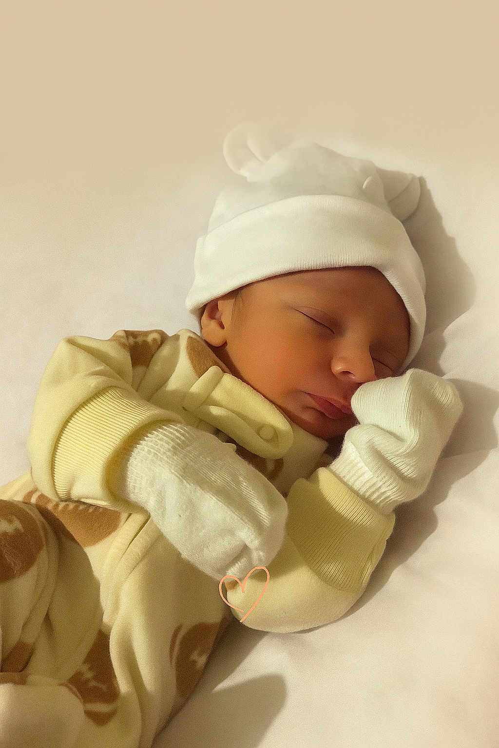 Jaylen joined the competition — help win amazing prizes! baby, newborn, sleeping, pajamas, mittens, hat, cute, cozy, soft, peaceful, infant, resting, child, portrait, warm, indoor, closeup, face, headwear, blanket