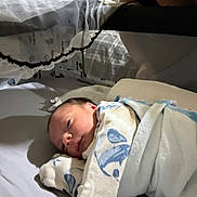 Jaylen joined the competition — help win amazing prizes! baby, newborn, blanket, crib, sleeping, infant, bed, soft, wrapped, cozy, face, person, indoors, resting, child, cute, peaceful, nursery, fabric, comfort