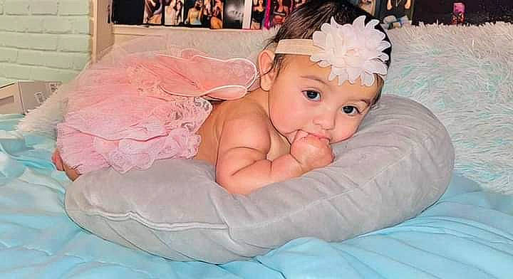 Cicily Luna Avila Mota is registered to the contest to win money with this photo: aqua, baby, baby_products, baby_toddler_clothing, bathing, child, comfort, event, fashion_accessory, fun, happy, headband, headpiece, headwear, leisure, linens, person, picture_frame, pink, product