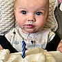 baby, child, face, blue_eyes, highchair, birthday_cake, candle, cream, frosting, celebration, cute, infant, clothing, indoor, portrait, expression, curious, food, party, smile