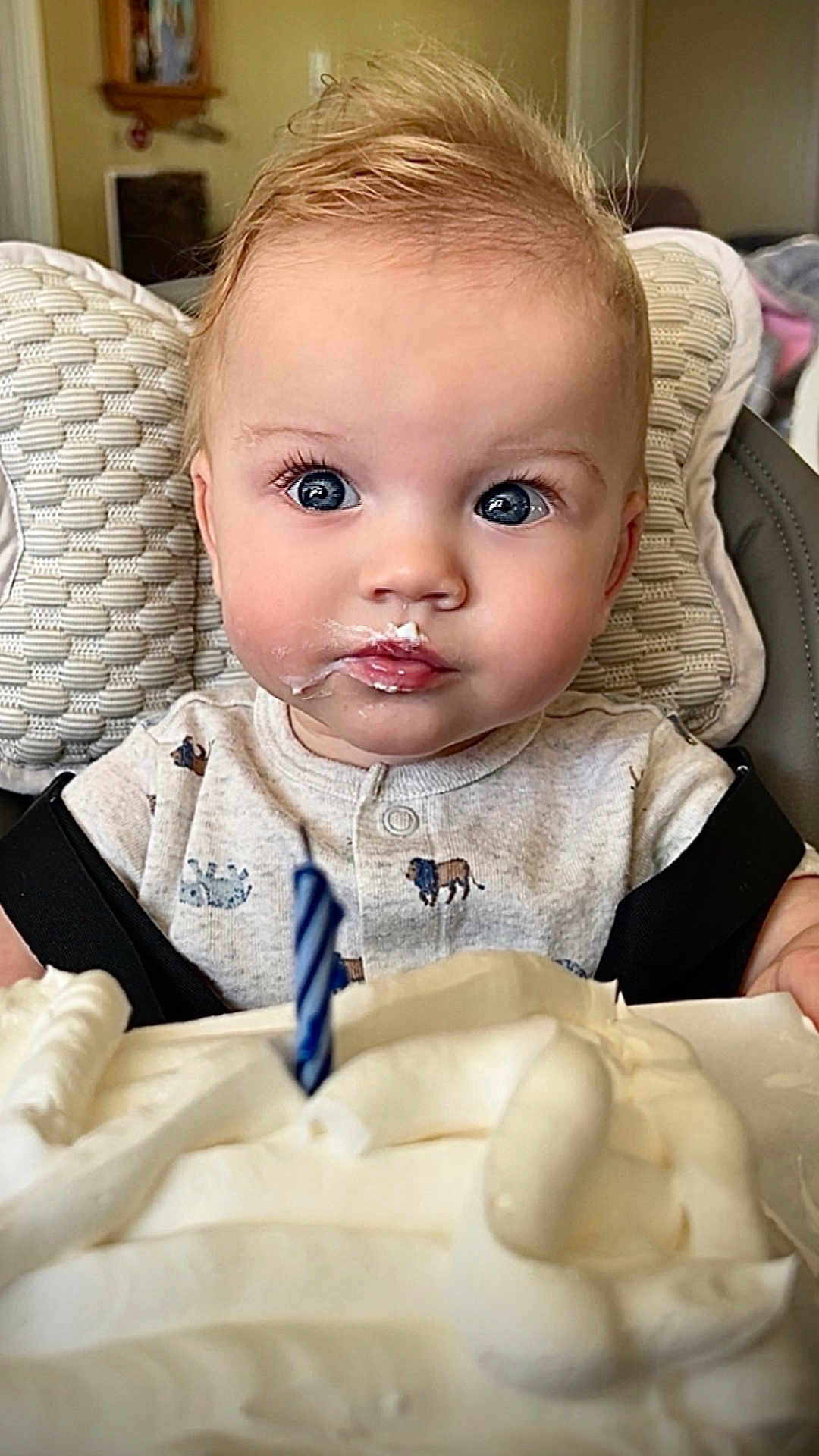 Mateo joined the competition — help win amazing prizes! baby, child, face, blue_eyes, highchair, birthday_cake, candle, cream, frosting, celebration, cute, infant, clothing, indoor, portrait, expression, curious, food, party, smile