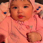 Kylie is registered to the contest to win money with this photo: baby, child, pink_clothing, hat, bow, blanket, heart_pattern, cute, portrait, infant, closeup, indoor, soft_texture, warm_colors, young_child, face, hand, expression, adorable, newborn