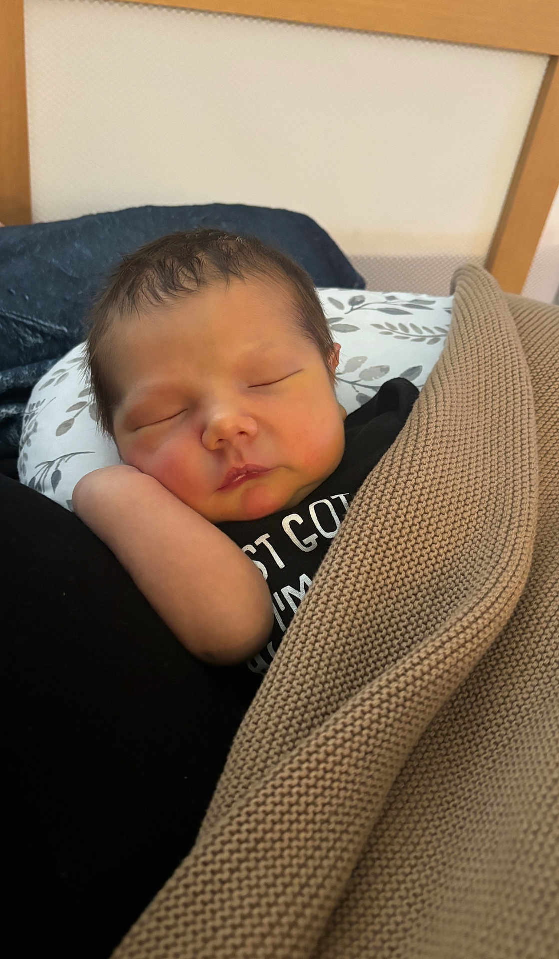Brayden is registered to the contest to win money with this photo: newborn, baby, sleeping, blanket, pillow, infant, cozy, resting, cute, peaceful, face, head, knit, arm, closeup, indoors, person, soft, comfort, toddler