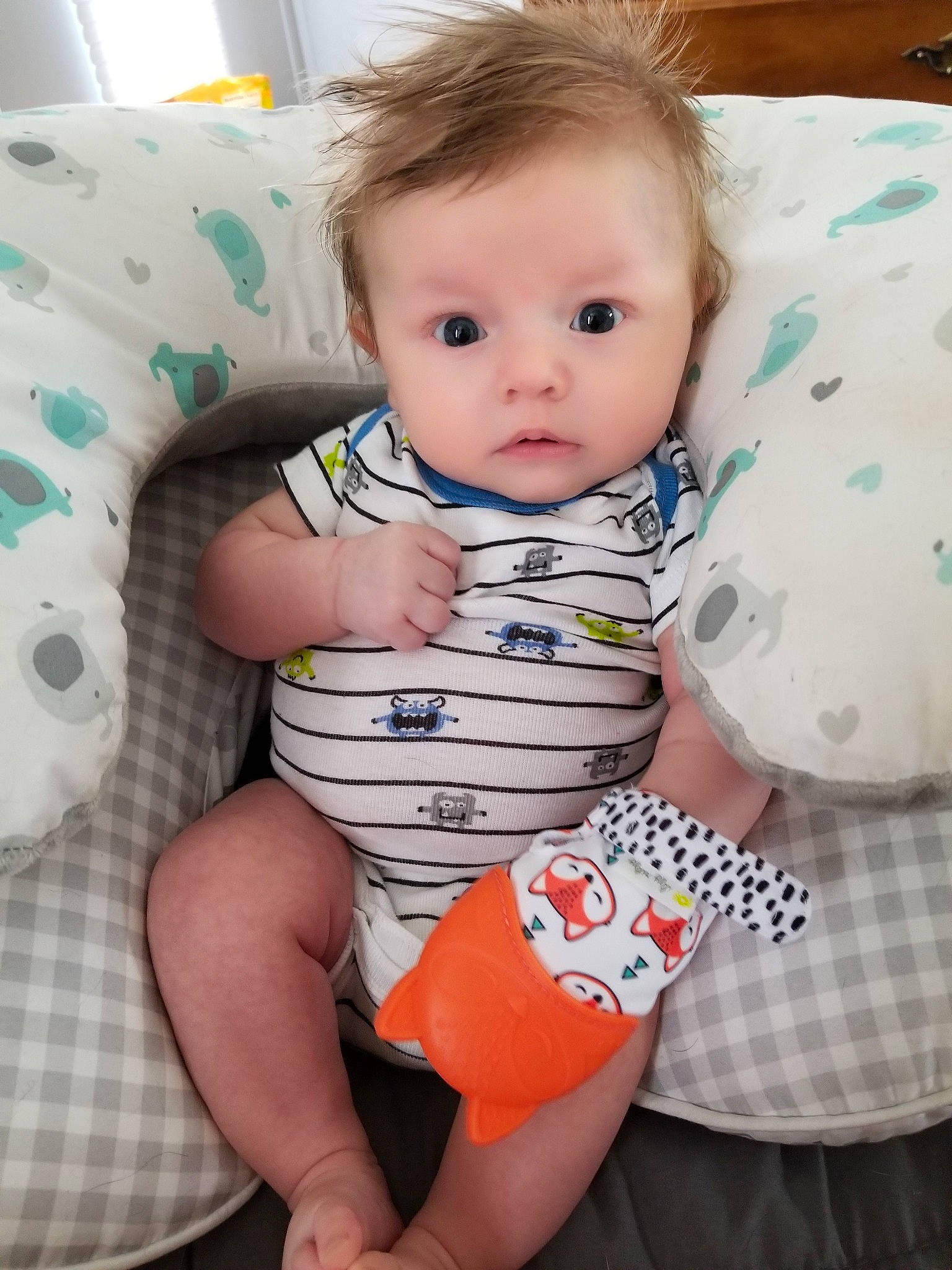 Justin is registered to the contest to win money with this photo: baby, baby_products, baby_toddler_clothing, cheek, child, person, play, sitting, skin, toddler