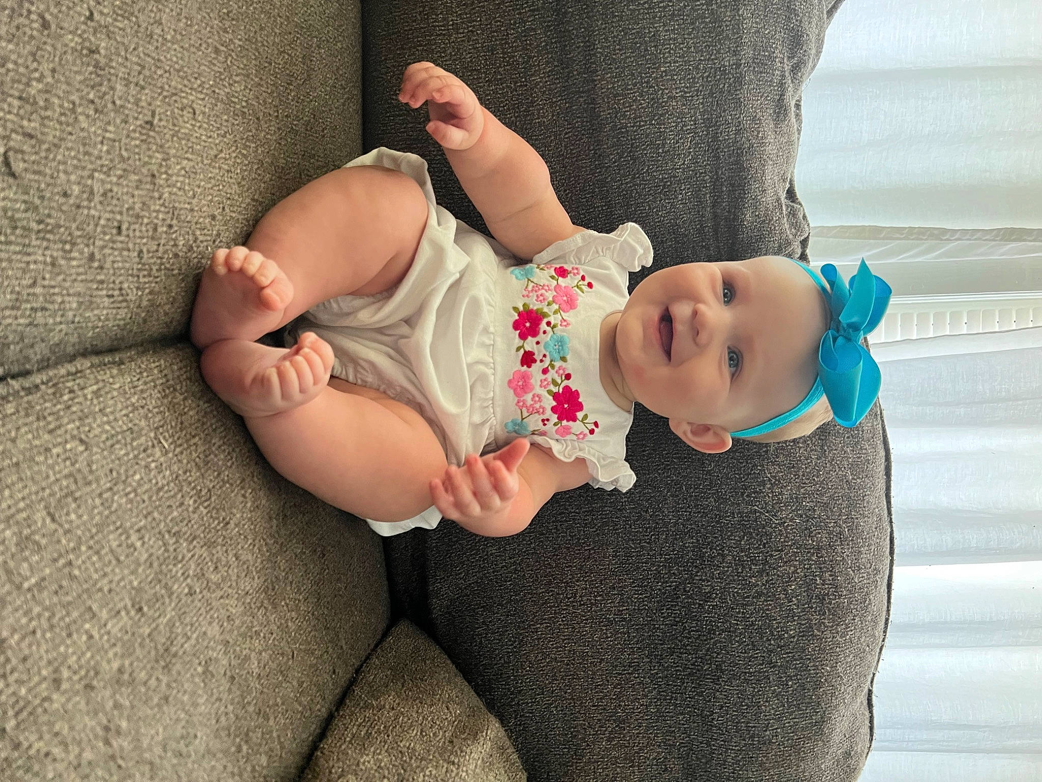 Hadleigh is registered to the contest to win money with this photo: baby, baby_toddler_clothing, comfort, eye, face, fawn, foot, head, human_leg, joint, joy, knee, linens, person, pink, skin, sock, stomach, thigh, toddler