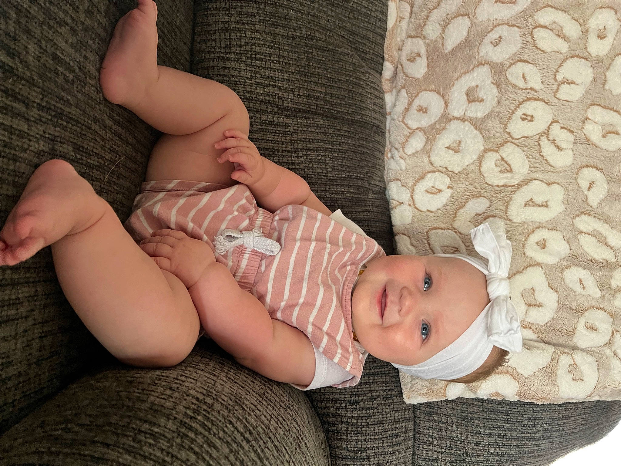 Hadleigh is registered to the contest to win money with this photo: arm, baby, baby_toddler_clothing, child, comfort, face, finger, flash_photography, hand, headgear, headwear, human, human_body, joy, leg, pattern, person, skin, sleeve, stomach