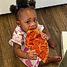 Loni joined the competition — help win amazing prizes! box, child, clothing, cute, eating, expression, floor, food, foot, hair_puffs, hand, indoor, meal, pepperoni, person, pizza, sitting, snack, toddler, wooden_floor