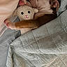 Bronze is registered to the contest to win money with this photo: puppy, dog, sleeping, nap, bed, blanket, quilt, stuffed_animal, sheep_toy, cozy, indoors, pet, paw, leg, brown_and_white, wrinkles, snuggled, cute, soft, portrait