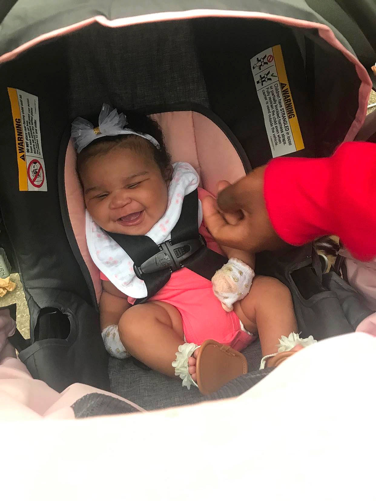 Stormi is registered to the contest to win money with this photo: auto_part, automotive_design, baby, baby_carriage, baby_products, baby_toddler_clothing, car_seat, child, comfort, event, family_car, fun, happy, hat, headwear, joy, lap, leisure, luxury_vehicle, motor_vehicle