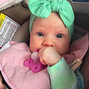 Lainey is registered to the contest to win money with this photo: accessories, baby, bodypart, bonnet, clothing, coat, cushion, cutlery, face, finger, hand, hat, head, homedecor, jacket, newborn, person, photography, portrait, purple