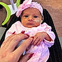 Faith joined the competition — help win amazing prizes! baby, infant, pink_clothing, headband, bow, hand, fingers, nails, hospital, medical_tube, face, eyes, person, newborn, cute, portrait, holding, skin, caring, tender