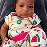 baby, child, infant, portrait, sitting, indoors, bow, pink_bow, colorful_clothing, fruit_pattern, watermelon, cherry, banana, kiwi, blanket, chair, happy, face, eyes, baby_socks