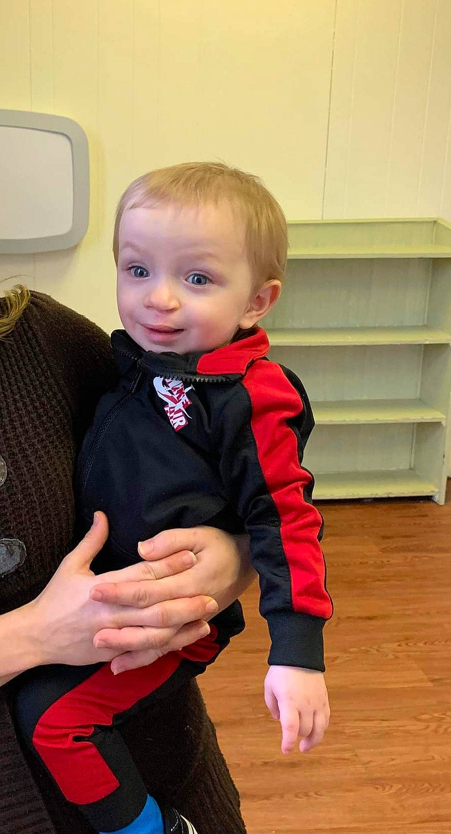 Braxton is registered to the contest to win money with this photo: baby, baby_toddler_clothing, cheek, collar, face, finger, flooring, formal_wear, fun, gesture, happy, hardwood, joint, person, skin, sleeve, standing, thumb, tie, toddler