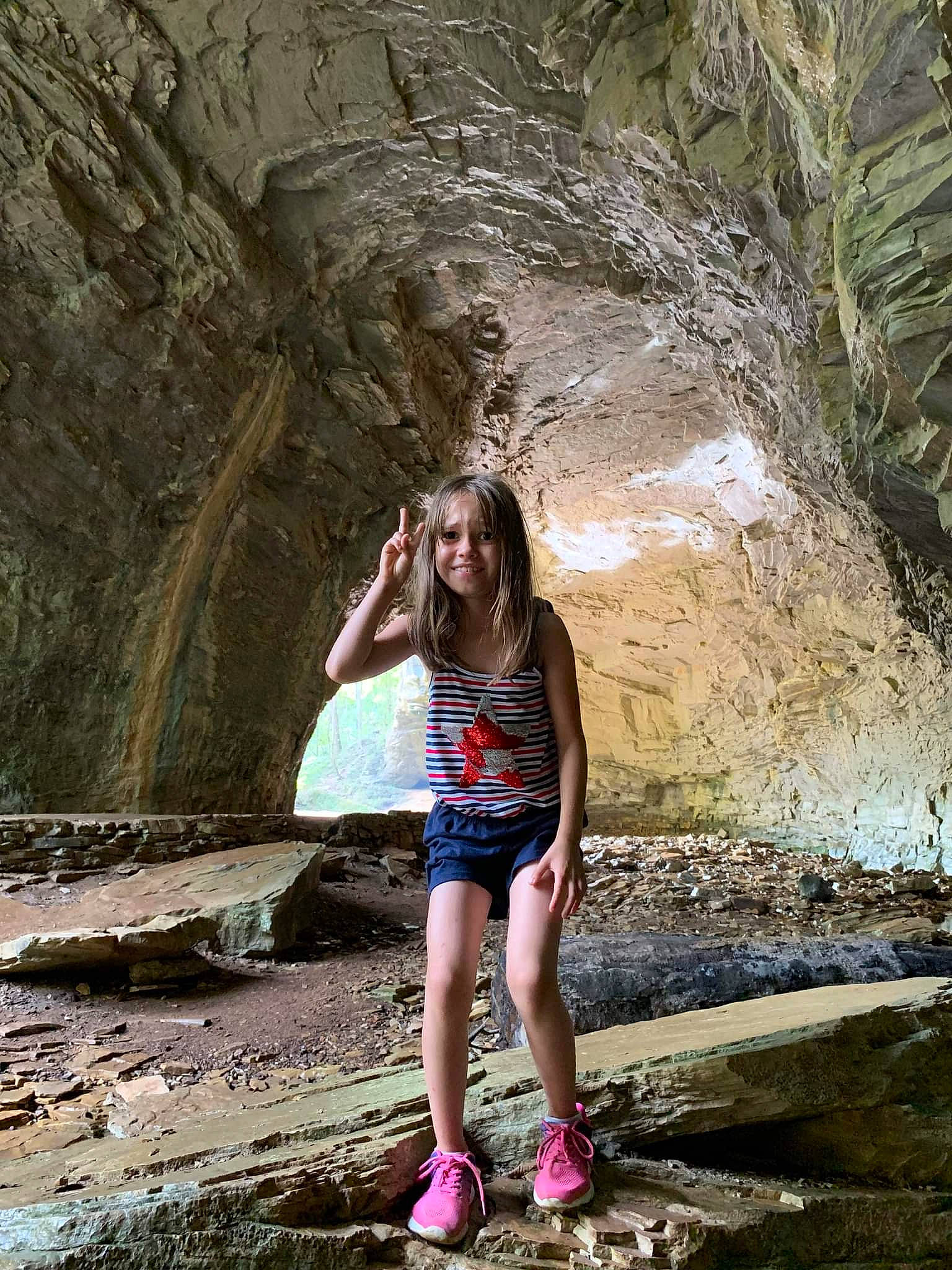 Lexi is registered to the contest to win money with this photo: blond, brown_hair, eyewear, flash_photography, formation, fun, grass, human_leg, joy, landscape, leisure, long_hair, nature, people_in_nature, person, rock, street_fashion, t_shirt, thigh, tints_and_shades