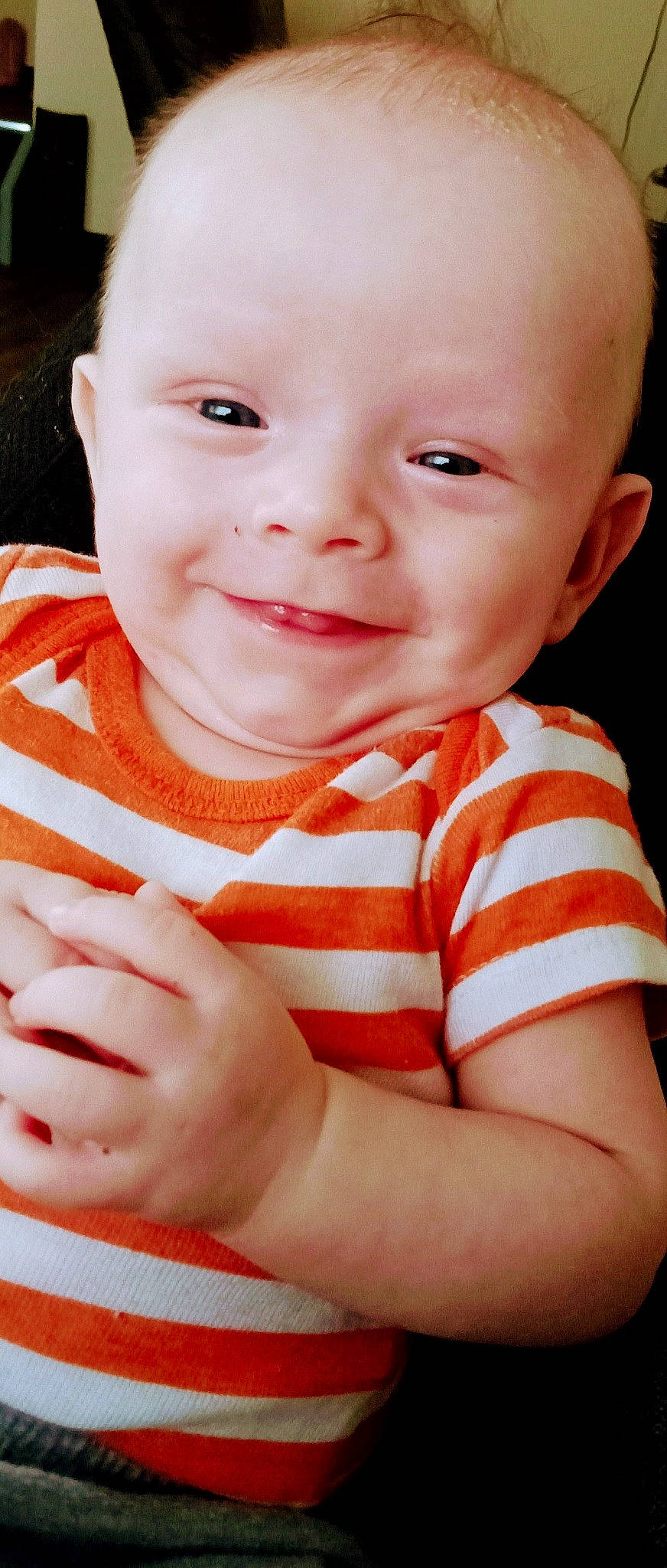 Hunter is registered to the contest to win money with this photo: baby, baby_toddler_clothing, cheek, child, collar, finger, fun, gesture, grass, hand, happy, iris, joy, lip, nail, person, sitting, skin, sleeve, smile