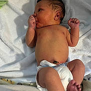 Kiyhiem Jr joined the competition — help win amazing prizes! newborn, baby, infant, diaper, blanket, lying_down, hand, thumb_sucking, headwear, skin, foot, toe, hospital, cute, resting, sleepy, soft_texture, indoors, person, child