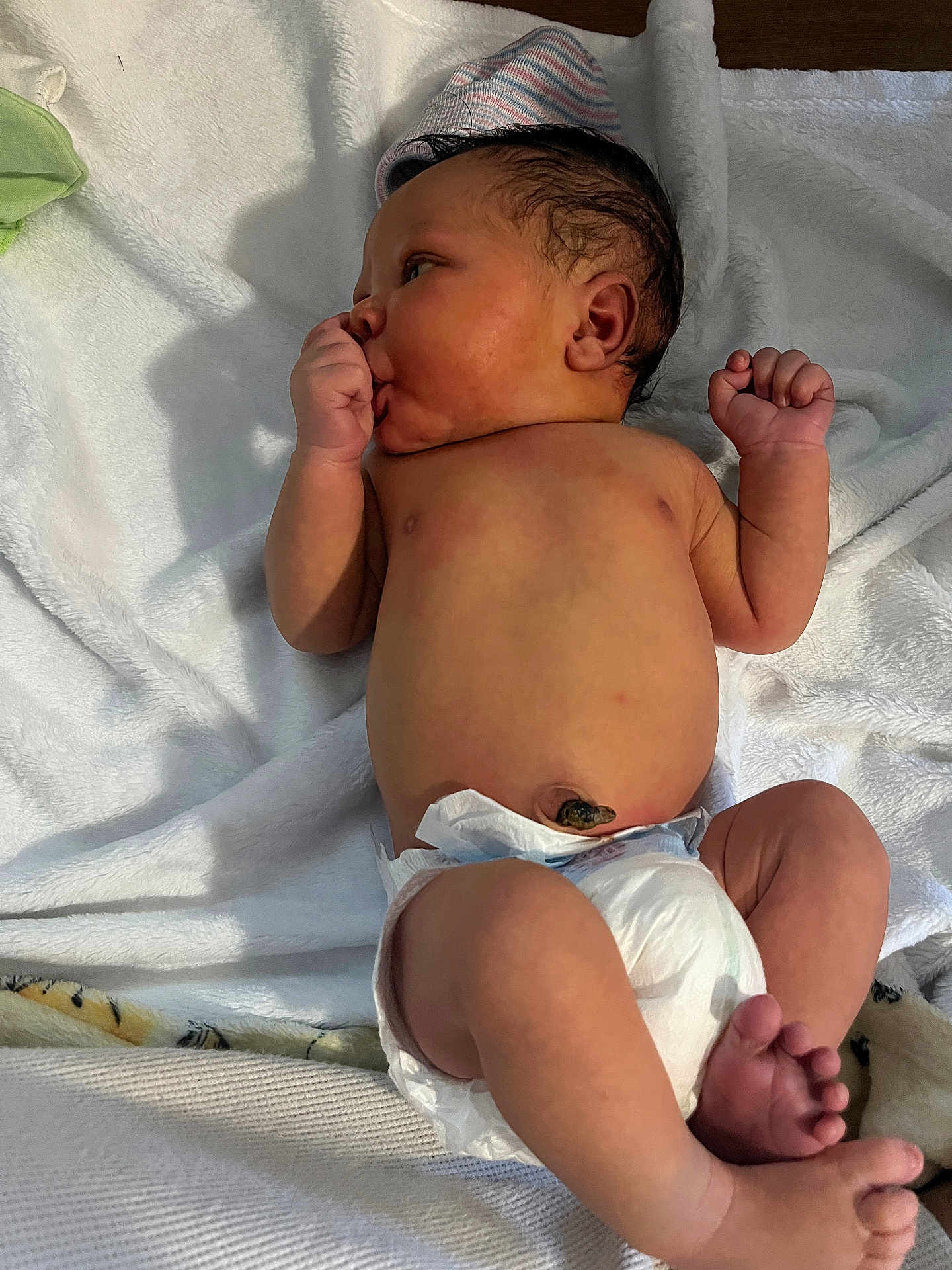 Kiyhiem Jr joined the competition — help win amazing prizes! newborn, baby, infant, diaper, blanket, lying_down, hand, thumb_sucking, headwear, skin, foot, toe, hospital, cute, resting, sleepy, soft_texture, indoors, person, child