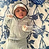 Christopher joined the competition — help win amazing prizes! baby, infant, face, person, clothing, hoodie, mittens, headband, blanket, pattern, nike, blue, white, cute, lying_down, tongue_out, soft_fabric, comfortable, indoor, portrait