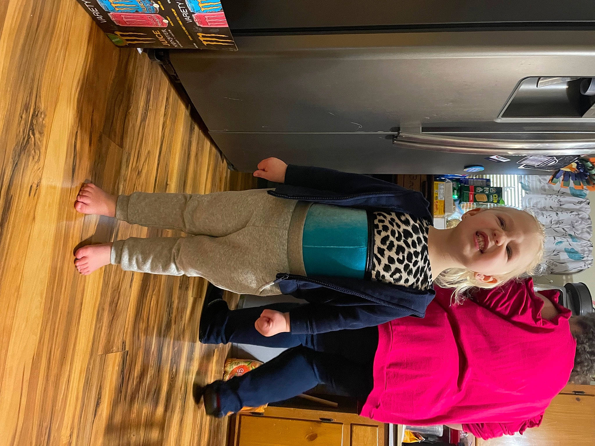 Mckenna joined the competition — help win amazing prizes! ceiling, cleanliness, clothing, flooring, fun, hardwood, outdoor_shoe, person, room, smile, varnish, walking_shoe, wood