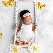 Mia Michelle joined the competition — help win amazing prizes! baby, infant, sleeping, swing, white_dress, floral_headband, flowers, butterflies, clouds, soft_texture, cute, portrait, newborn, decorative, studio_photo, peaceful, hands, feet, indoor, adorable