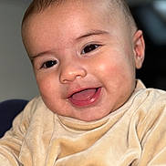 Levi joined the competition — help win amazing prizes! baby, smiling, face, close_up, child, infant, happy, eyes, clothing, portrait, cute, skin, expression, cozy, indoors, young, person, cheerful, soft, warm