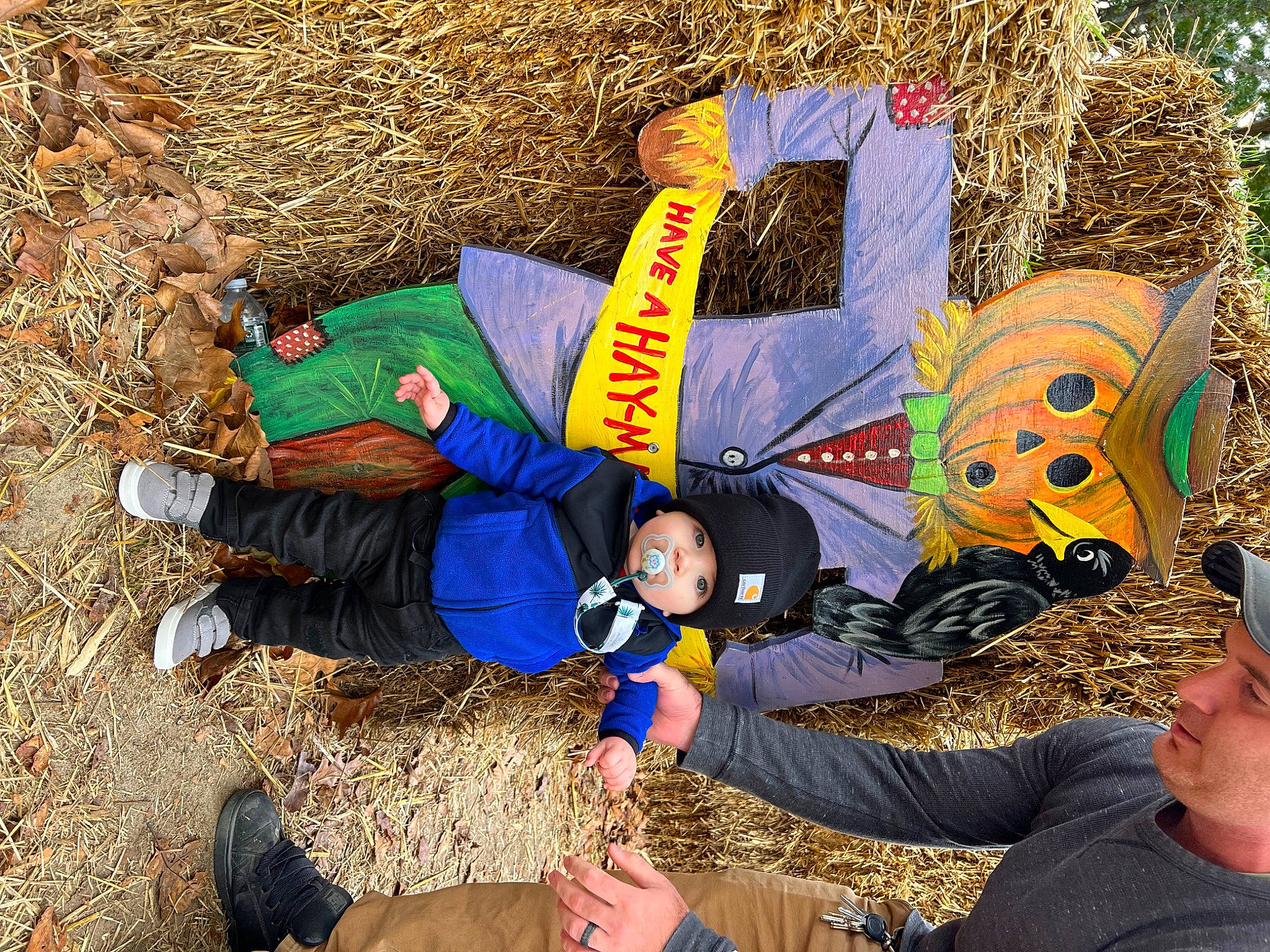 Jase joined the competition — help win amazing prizes! boot, clothing, fun, grass, happy, hat, headwear, leisure, outerwear, people_in_nature, person, personal_protective_equipment, photograph, play, recreation, shoe, sitting, smile, sneakers, soil