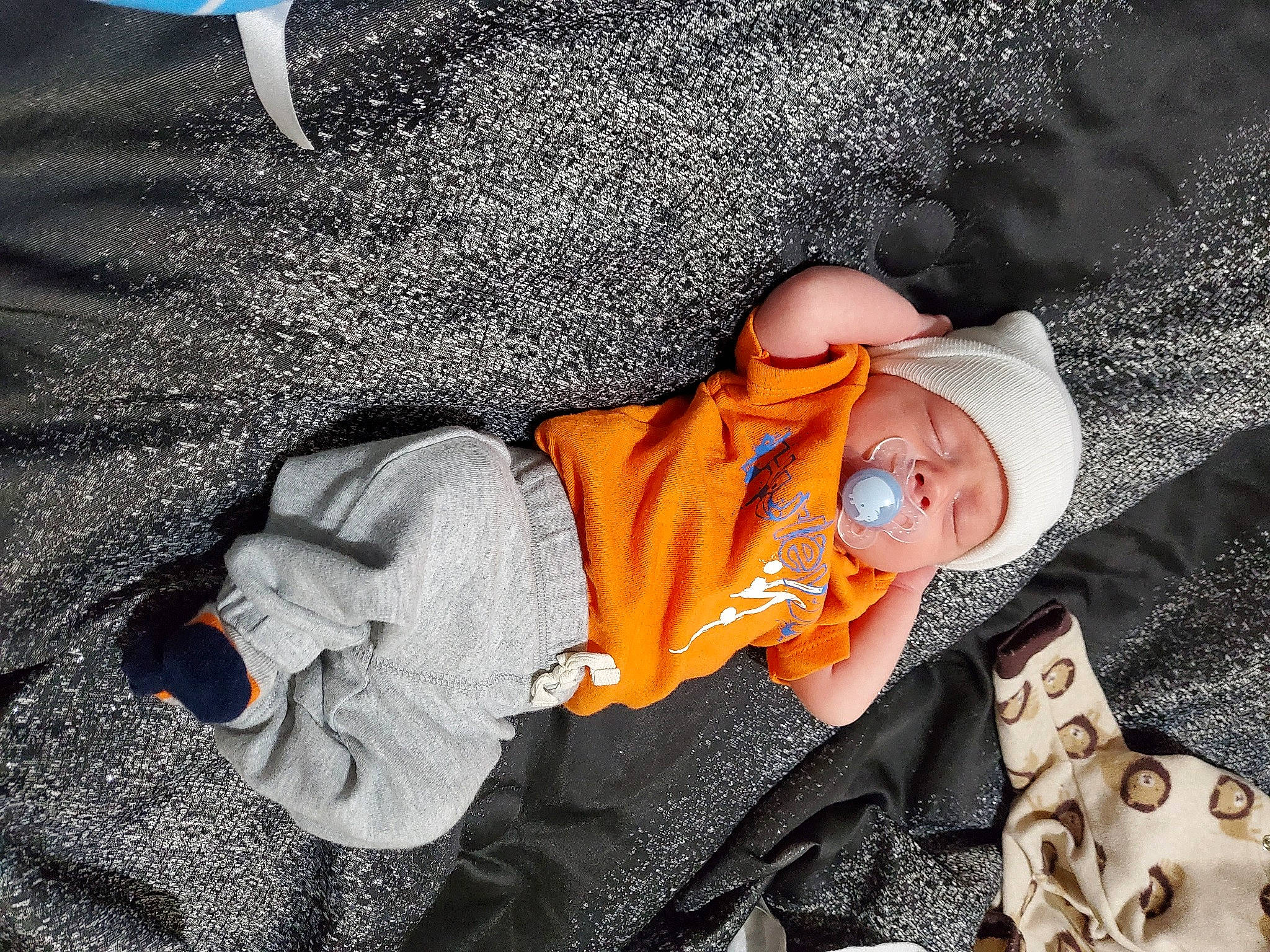 Kash joined the competition — help win amazing prizes! baby, baby_products, baby_toddler_clothing, brown, child, comfort, cool, flooring, fun, human, knit_cap, linens, nap, orange, person, sitting, skin, sleep, toddler, tree