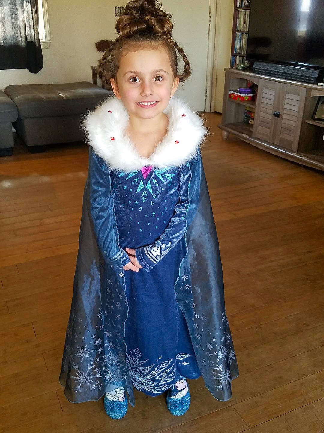 Madison is registered to the contest to win money with this photo: cabinetry, countertop, dress, electric_blue, embellishment, event, face, fashion_design, flooring, formal_wear, fur_clothing, glove, hair, headgear, home_appliance, joy, kitchen_appliance, person, sleeve, smile