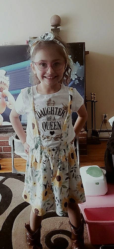 Madison is registered to the contest to win money with this photo: baby_toddler_clothing, chair, cool, eyewear, fashion_design, flooring, fun, hairstyle, happy, joy, pattern, person, shoulder, sleeve, smile, sportswear, standing, t_shirt, thigh, toddler