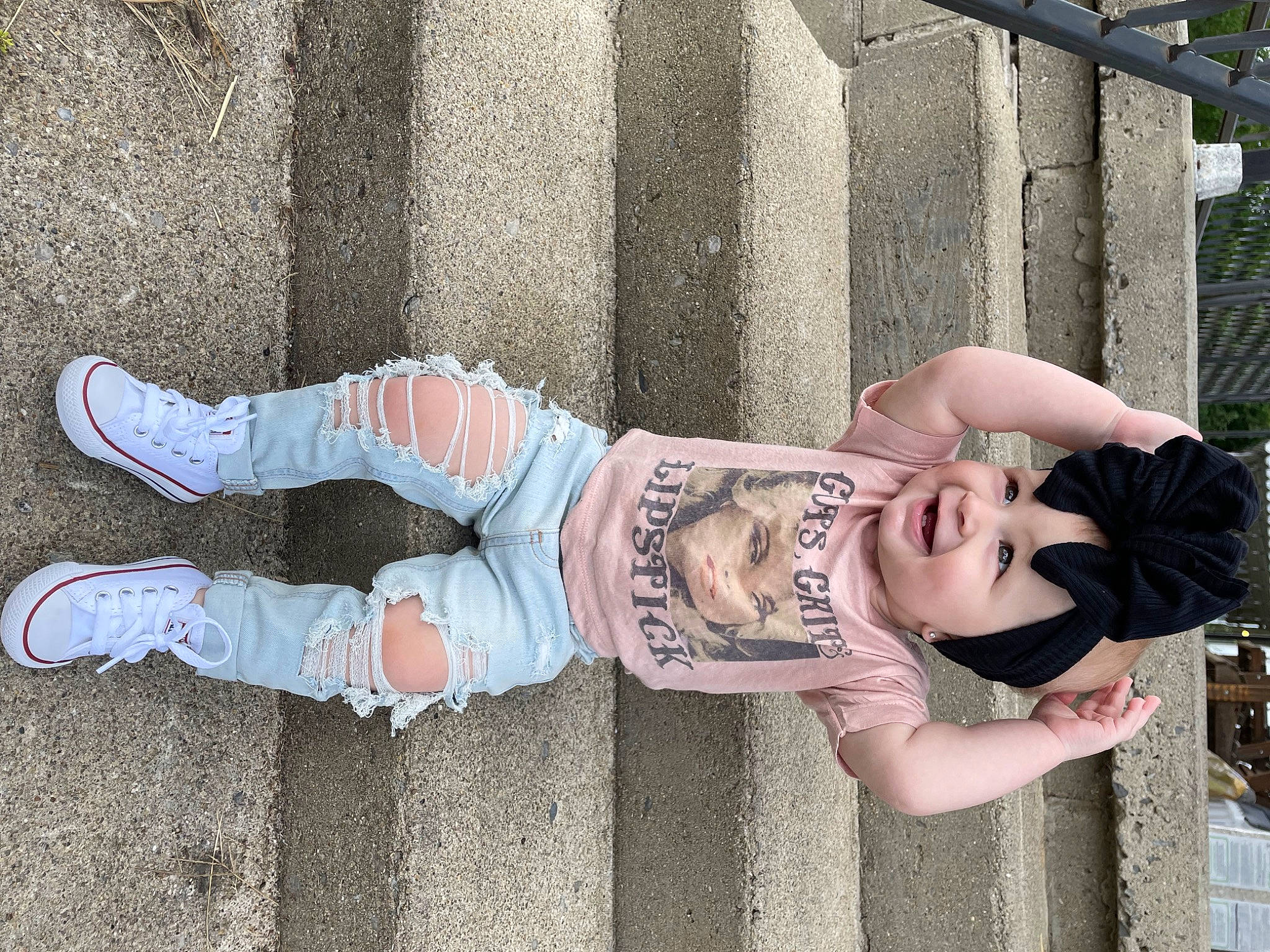 Kynlee joined the competition — help win amazing prizes! child, denim, eyewear, foot, fun, headwear, human_leg, knee, leg, leisure, pattern, person, sandal, sitting, smile, sock, thigh, toddler, tree, waist