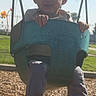 Jonathan joined the competition — help win amazing prizes! child, swing, playground, outdoor, toddler, grass, sunlight, fence, tree, clothing, shoes, socks, woodchips, person, play, daytime, park, seat, hands, legs
