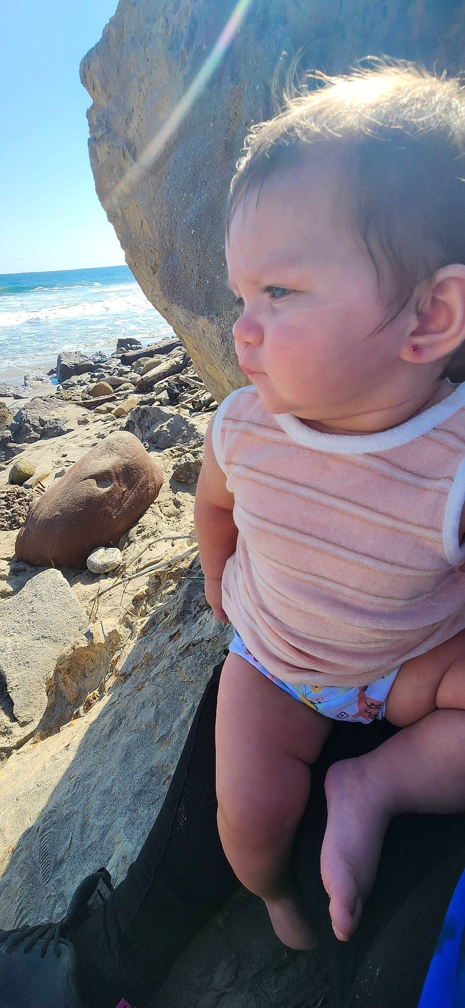 Evalina is registered to the contest to win money with this photo: baby, baby_toddler_clothing, beach, blue, eye, face, happy, head, human_body, lip, mouth, organ, person, photograph, skin, sky, summer, thigh, toddler, water