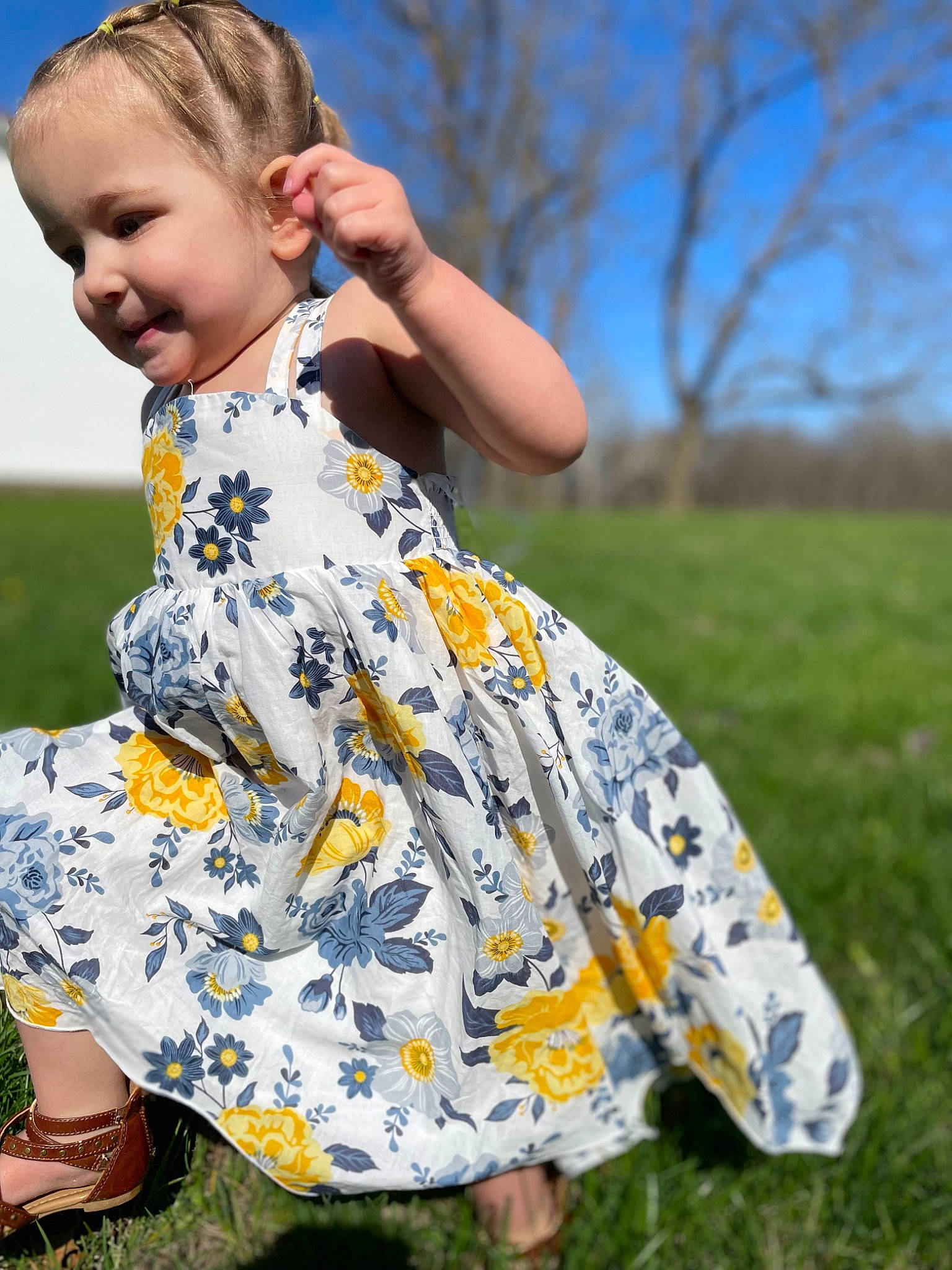 Brynlee is registered to the contest to win money with this photo: baby_toddler_clothing, blue, day_dress, dress, fashion_design, grass, grassland, hairstyle, happy, joy, leisure, meadow, pattern, people_in_nature, person, plant, recreation, shoulder, sky, sleeve