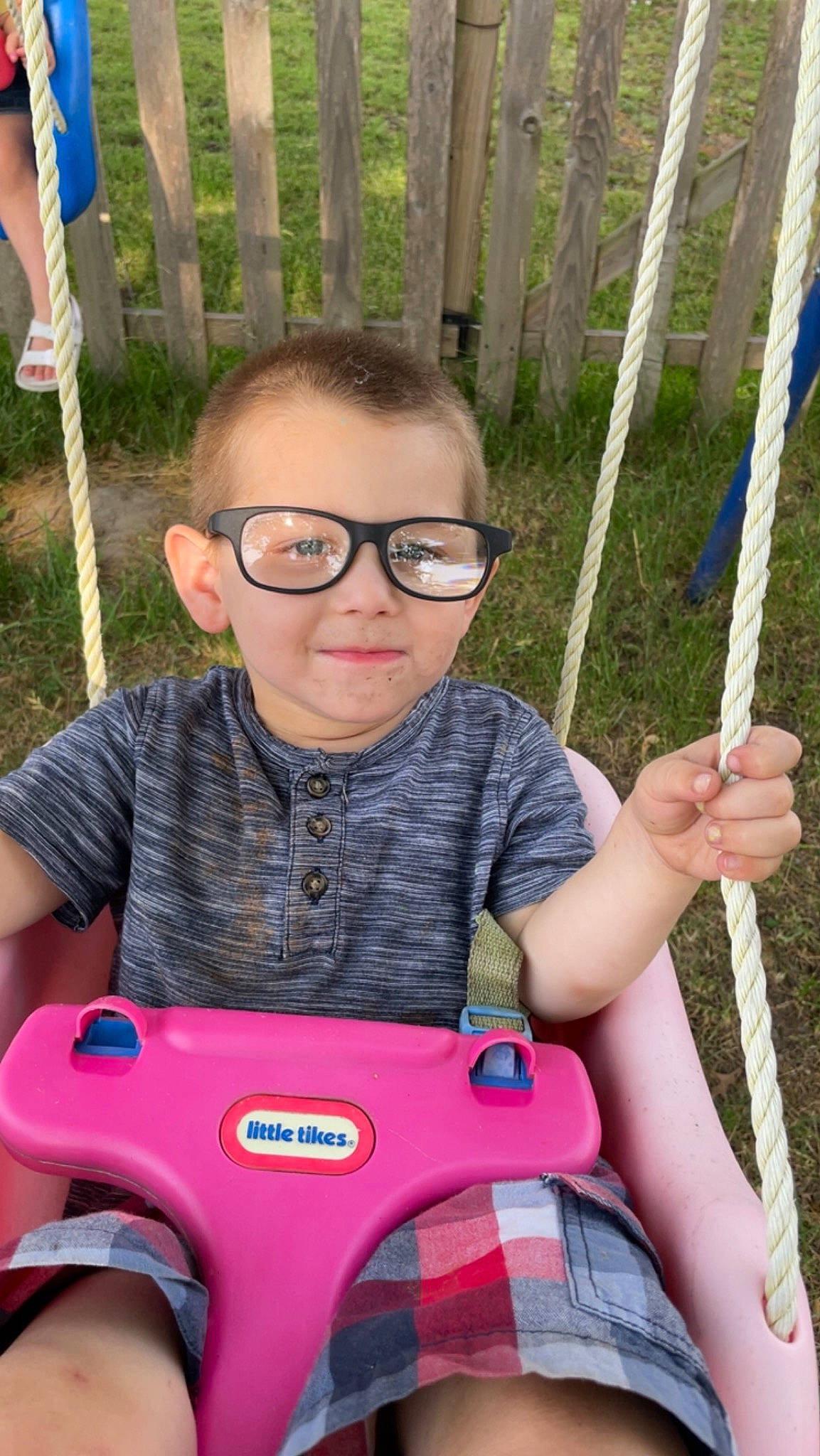 Brayson joined the competition — help win amazing prizes! blue, bumper, fun, grass, green, happy, leaf, leisure, organ, outdoor_play_equipment, people, person, product, public_space, recreation, shorts, smile, summer, swing, tartan