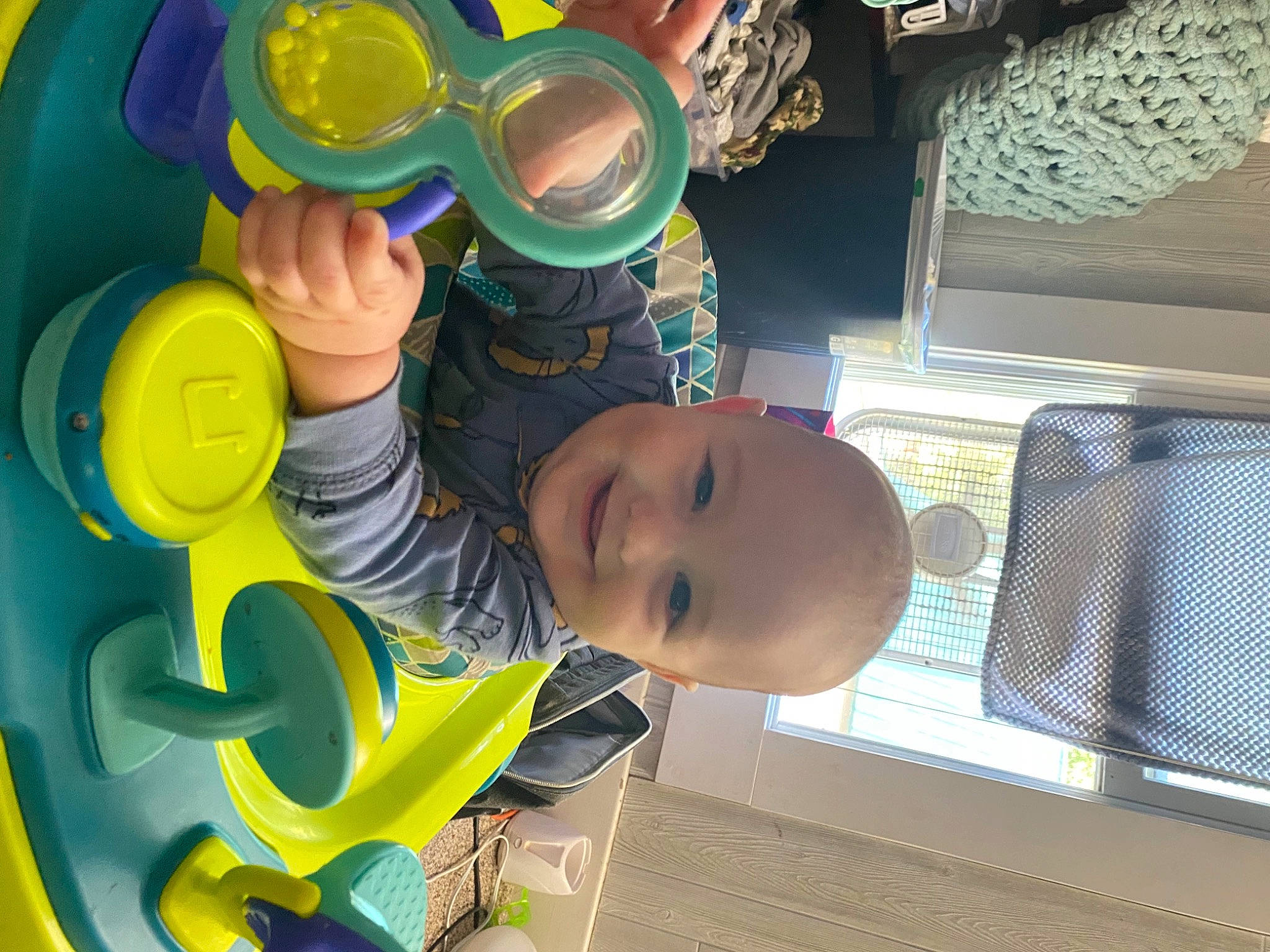 Waylen is registered to the contest to win money with this photo: baby, baby_products, baby_toddler_clothing, baby_toys, child, circle, drinkware, fun, happy, hat, headgear, joy, leisure, person, plastic, play, room, smile, t_shirt, toddler