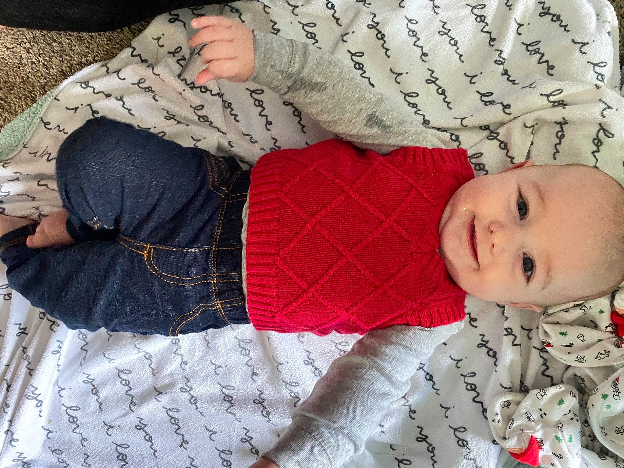 Waylen is registered to the contest to win money with this photo: baby_toddler_clothing, child, comfort, elbow, human_body, human_leg, joy, knee, lap, outerwear, pattern, person, plaid, skin, sleeve, sock, textile, thigh, toddler, waist