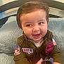 Maverick joined the competition — help win amazing prizes! baby, child, smiling, jacket, aviator, top_gun, maverick, patches, sunglasses, bed, quilted_bedspread, furniture, happy, face, person, indoor, cute, young_child, clothing, portrait