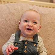 Jacob is registered to the contest to win money with this photo: baby, babylaughing, bodypart, clothing, coat, couch, face, finger, furniture, hand, happy, head, jacket, jeans, pants, person, photography, portrait, sitting, smile