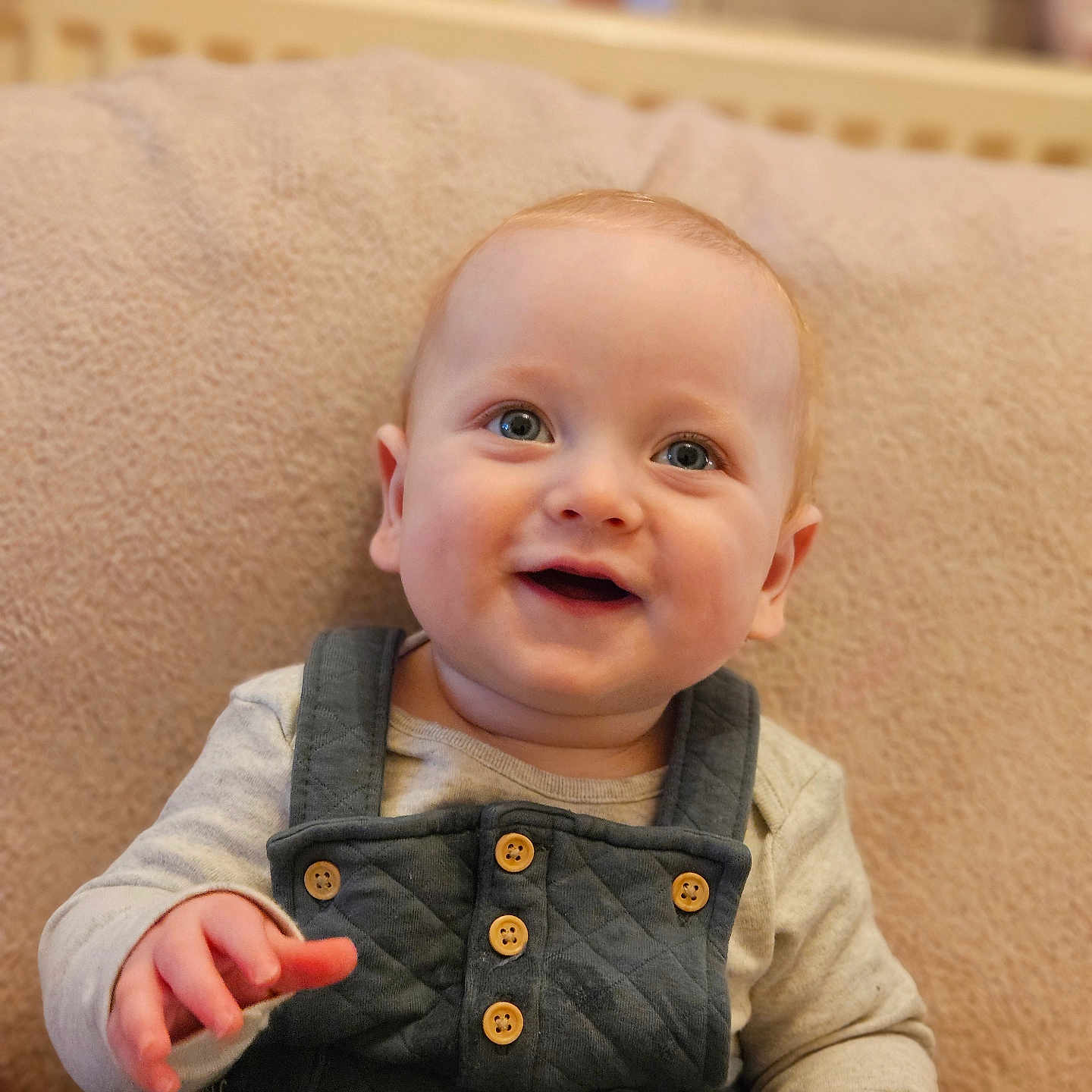 Jacob is registered to the contest to win money with this photo: baby, babylaughing, bodypart, clothing, coat, couch, face, finger, furniture, hand, happy, head, jacket, jeans, pants, person, photography, portrait, sitting, smile