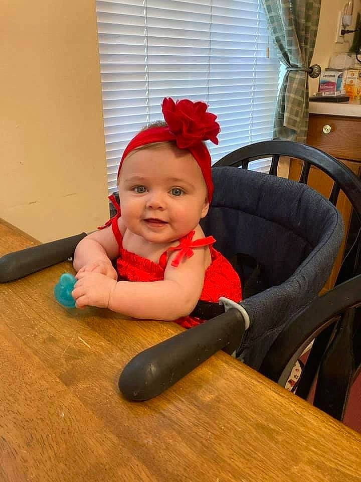 Ava joined the competition — help win amazing prizes! arm, baby, baby_toddler_clothing, carmine, chair, child, comfort, eye, flooring, hair, happy, hardwood, head, headwear, human_body, joy, person, sitting, smile, table
