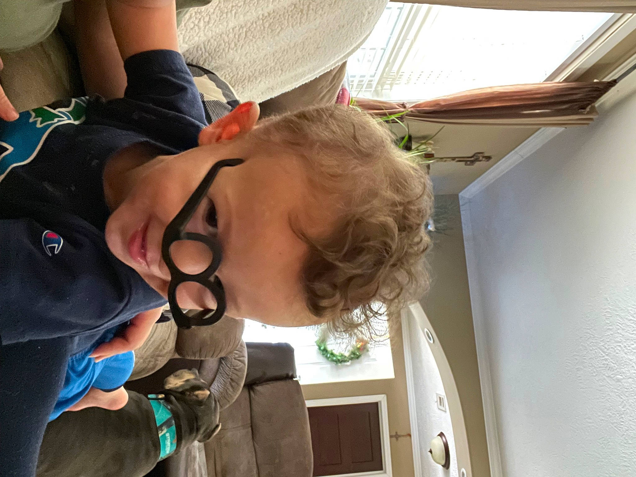 Khoen joined the competition — help win amazing prizes! baby, child, comfort, eyewear, fun, gesture, happy, leisure, person, personal_protective_equipment, room, sunglasses, toddler, tree, vacation, window