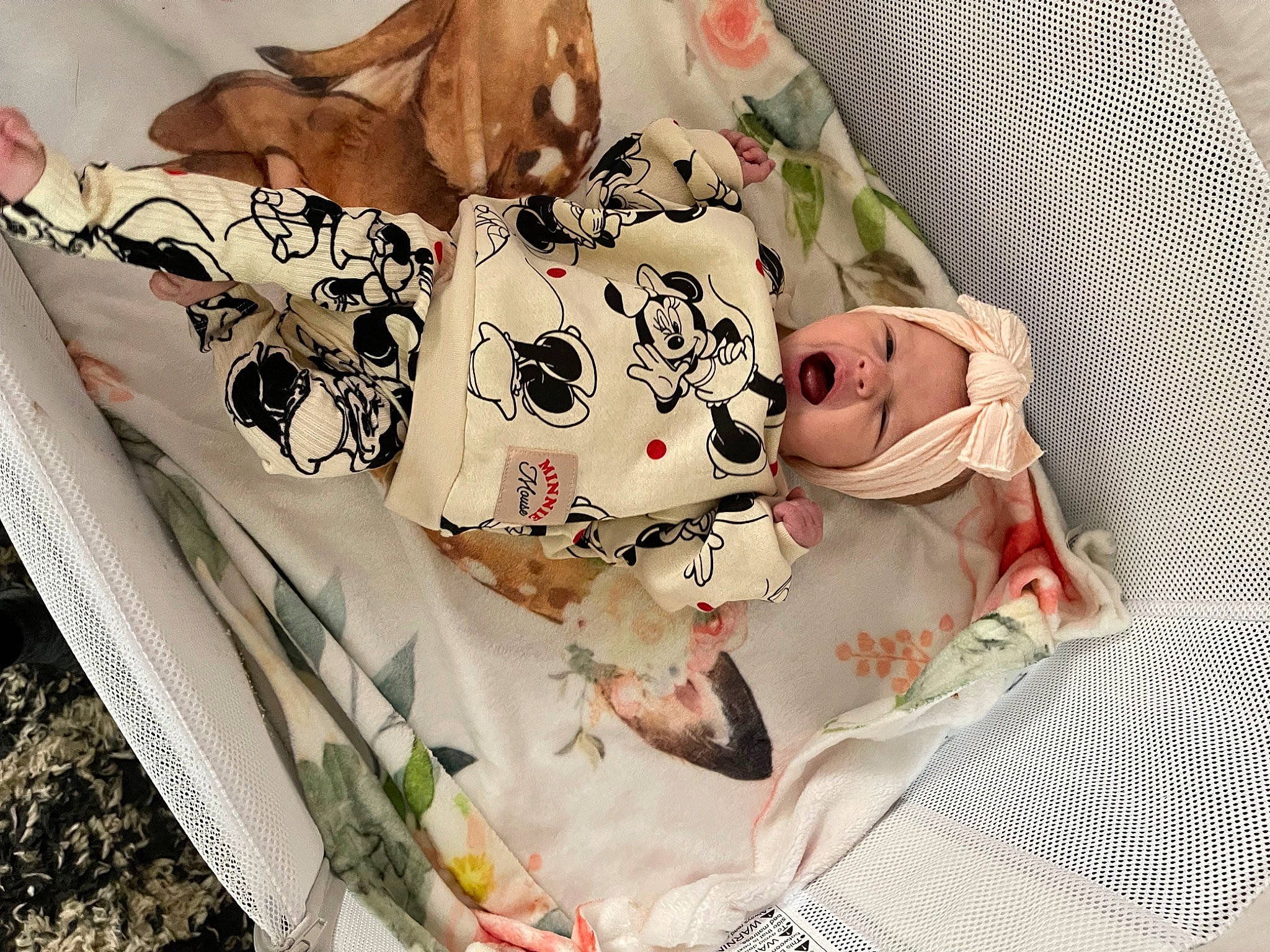 Stella is registered to the contest to win money with this photo: baby, baby_products, baby_toddler_clothing, bedding, child, comfort, dress, fashion_accessory, hand, head, headwear, linens, paper, pattern, peach, person, petal, plant, room, rose