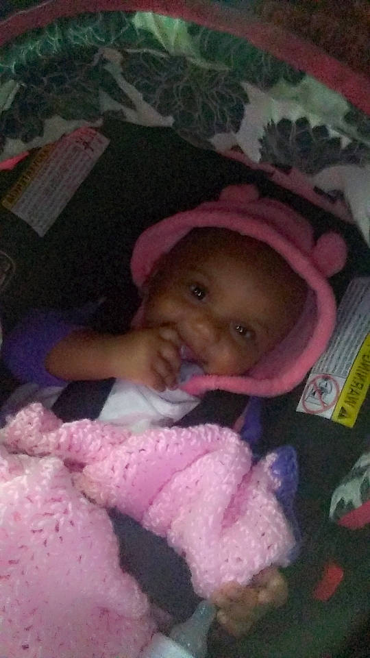 Ella joined the competition — help win amazing prizes! baby, baby_products, baby_toddler_clothing, cap, cheek, child, comfort, eye, fashion_accessory, fun, happy, linens, magenta, person, pink, room, skin, smile, textile, toddler