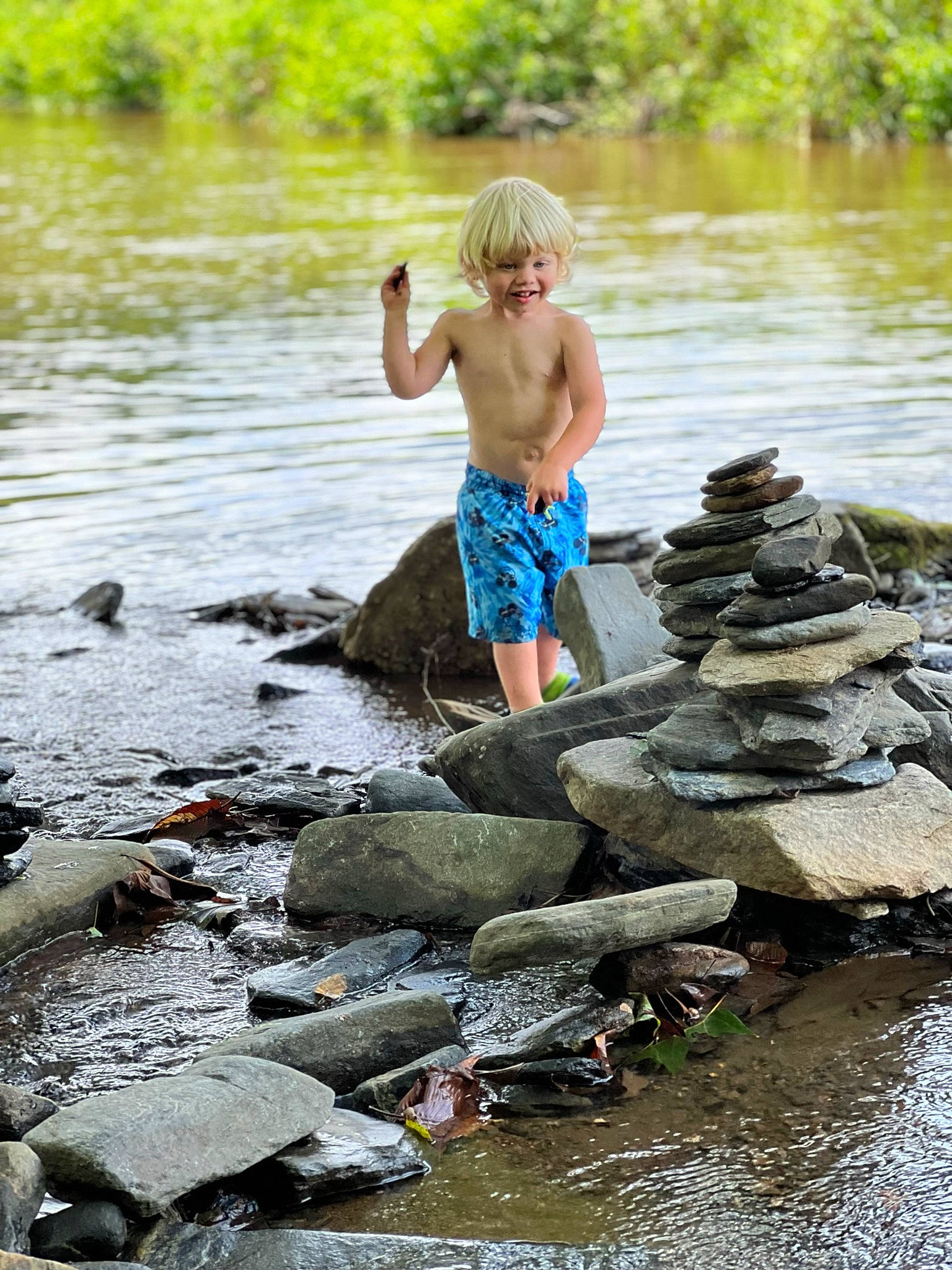 Grayson joined the competition — help win amazing prizes! bank, bedrock, child, creek, fluvial_landforms_of_streams, fun, grass, lake, leisure, people_in_nature, person, recreation, rock, shorts, stream, toddler, water, water_resources, watercourse, waterway