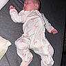 baby, sleeping, infant, onesie, pink, white, bow_pattern, bed, blanket, soft, cozy, child, cute, peaceful, portrait, resting, person, indoors, sleep, newborn