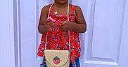 Khloe is registered to the contest to win money with this photo: toddler, child, sunglasses, strawberry, red_top, denim_skirt, patterned_tights, sneakers, straw_purse, standing, indoor, white_door, flooring, fashion, accessories, cute, portrait, person, young_child, hair_updo