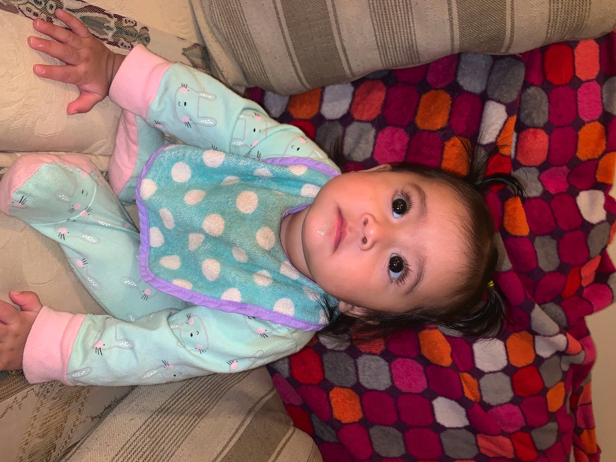 Jacqueline is registered to the contest to win money with this photo: arm, baby, baby_toddler_clothing, cheek, child, comfort, design, eye, flooring, head, nose, pattern, person, pink, plaid, skin, sleeve, tartan, textile, toddler