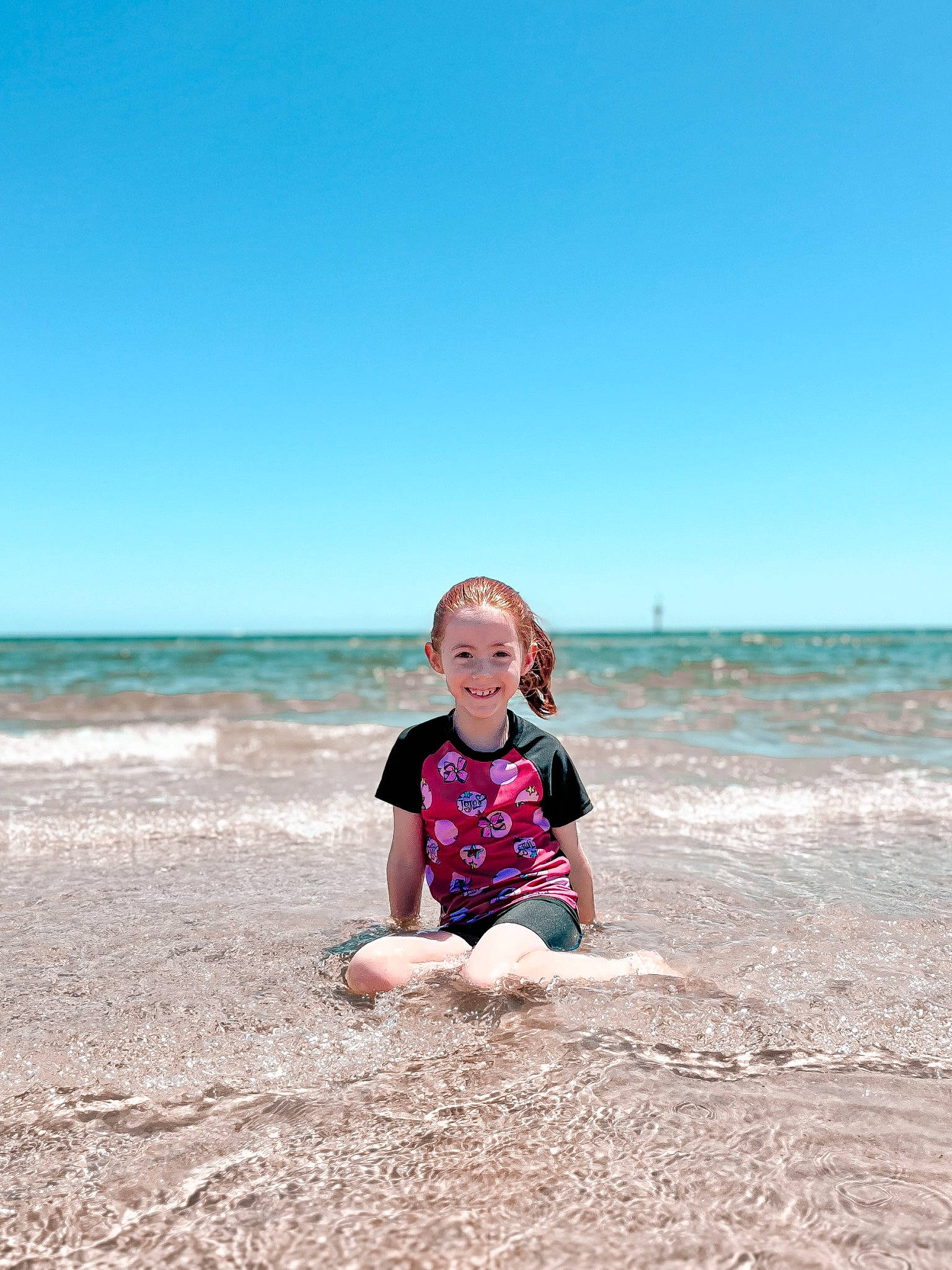 Imogen joined the competition — help win amazing prizes! beach, cloud, coastal_and_oceanic_landforms, fun, happy, head, holiday, horizon, joy, landscape, leg, leisure, people_in_nature, person, recreation, sand, sky, t_shirt, toddler, travel