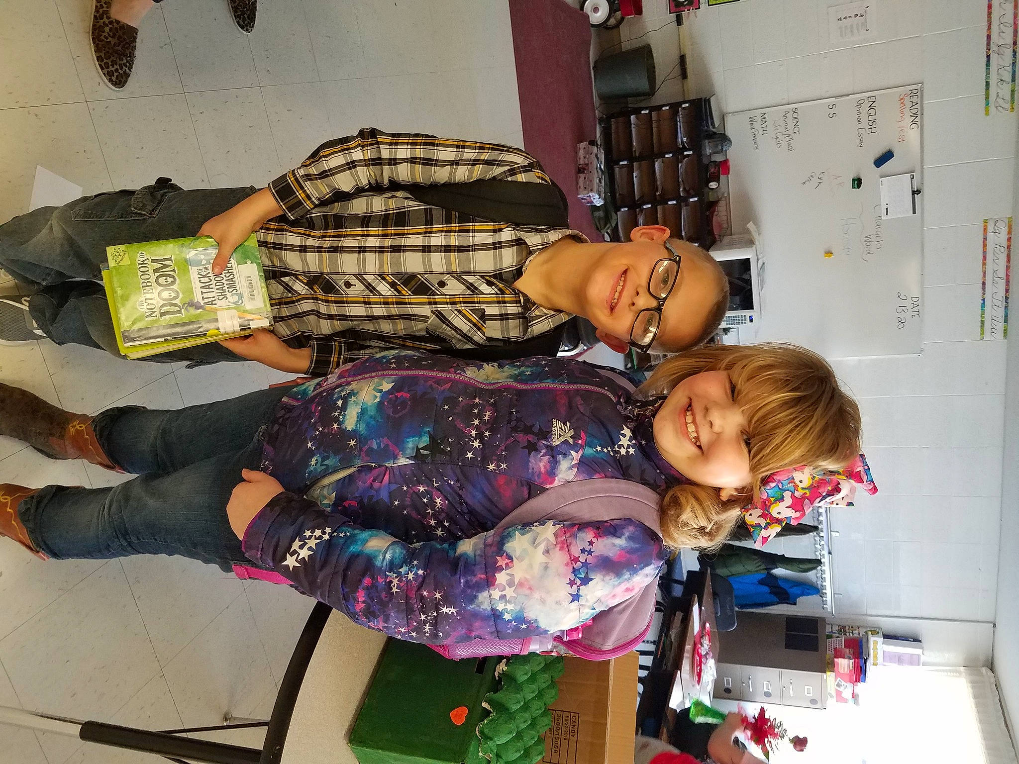 Kyla is registered to the contest to win money with this photo: bag, child, eyewear, fun, happy, joy, pattern, person, play, room, shelf, shelving, shoe, smile, thigh, toddler, visual_arts, wrist