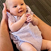 Ivy joined the competition — help win amazing prizes! baby, infant, smiling, hands, lavender_clothing, cute, portrait, skin, face, happy, child, person, flesh, sitting, young, newborn, arm, closeup, holding, background